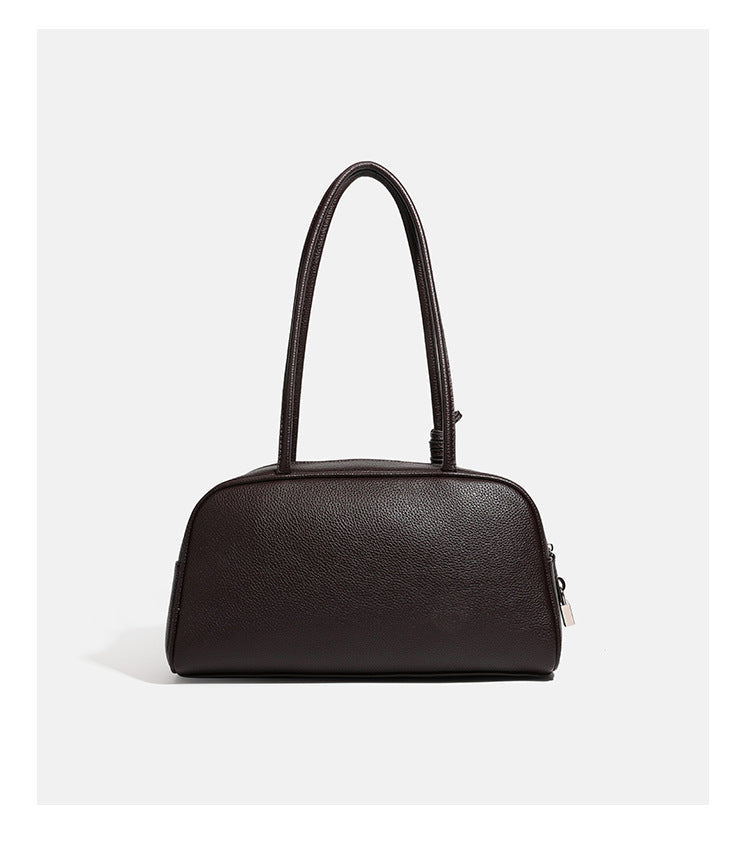 Structured rounded rectangular shoulder bag with pebbled leather-look finish, dual long handles, top zipper, front zip