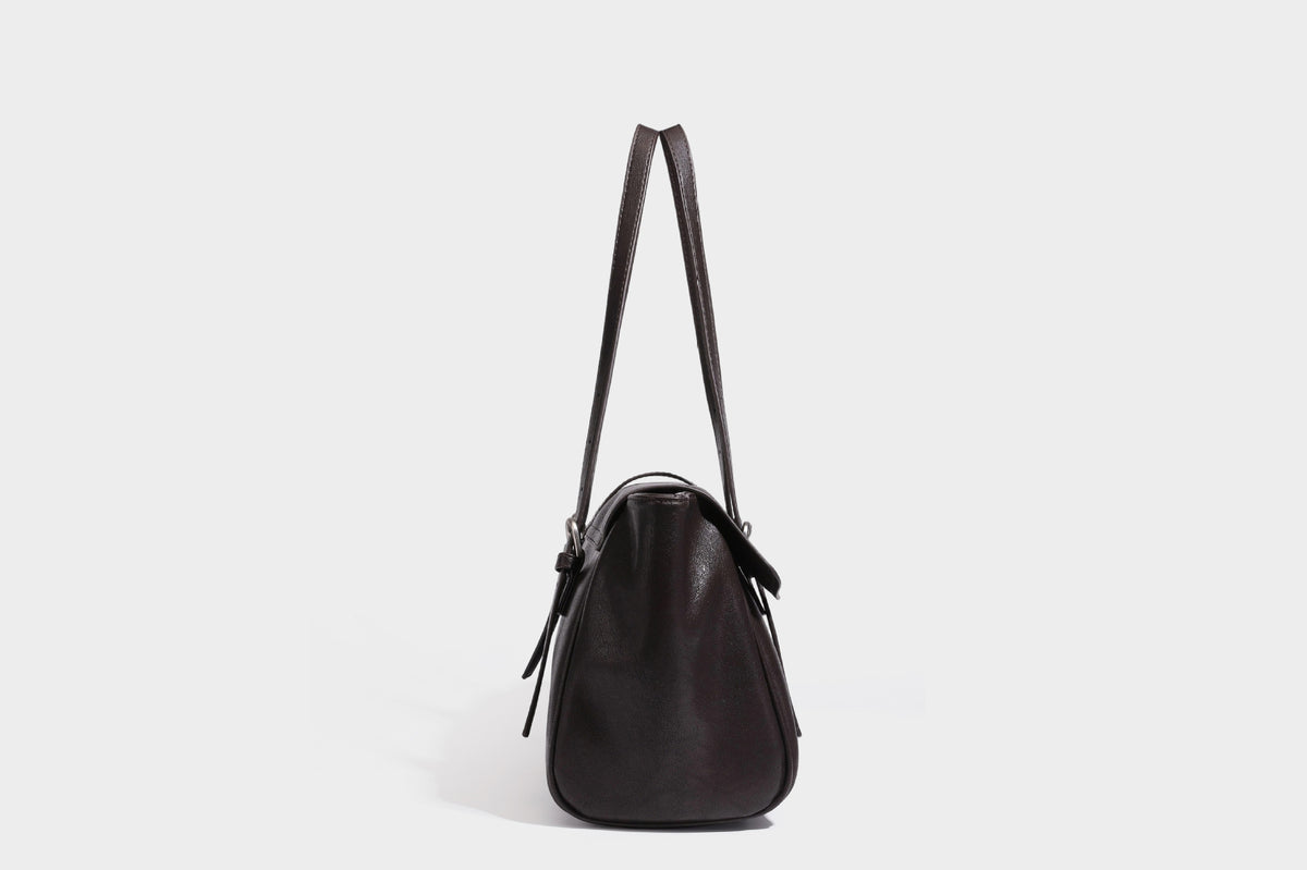 Large structured vintage-style tote bag with flap-front turn-lock closure, twin buckle straps, and double shoulder handles