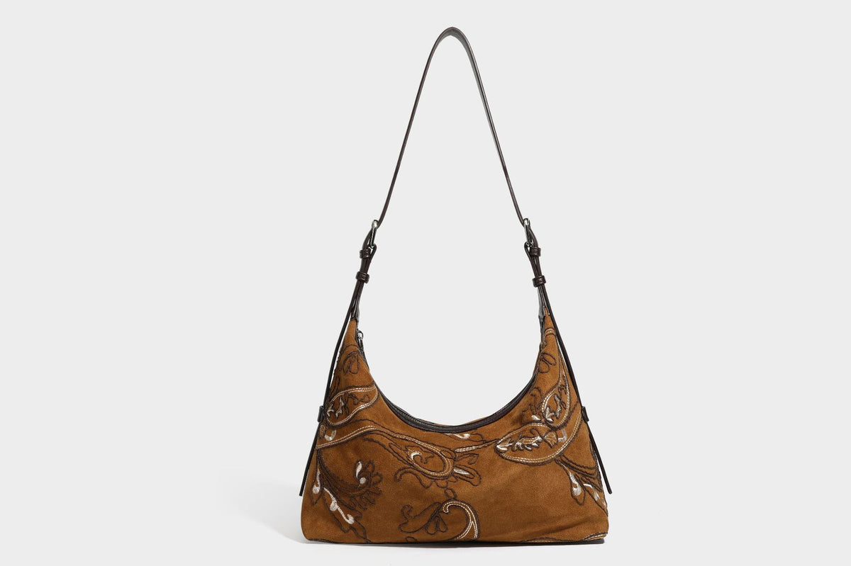 Deep chocolate suede-look hobo shoulder bag with tonal paisley floral embroidery, smooth dark leather-look trim, top zip