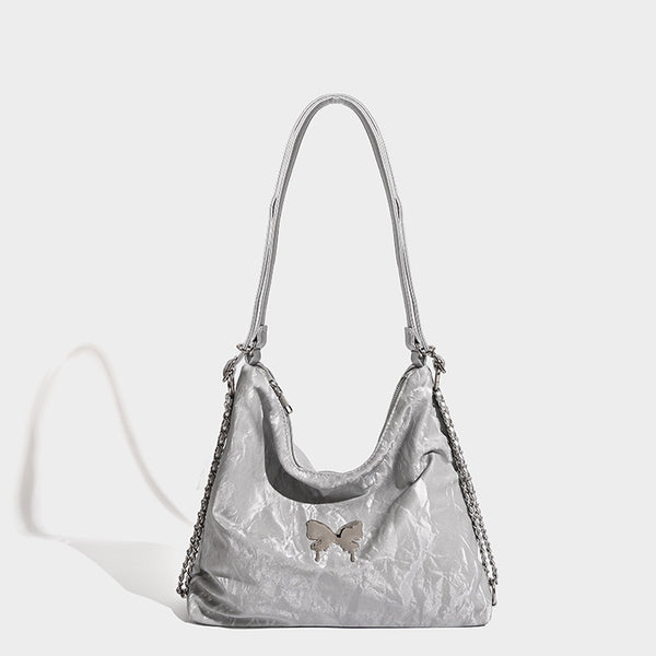 Crinkle-finish hobo shoulder bag with silver-tone chain side panels and butterfly embellishment, detail view 7