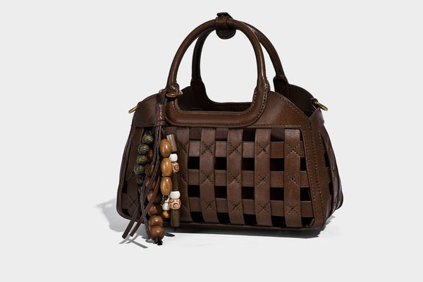 Small structured woven lattice top-handle satchel bag with bead-and-tassel charm and gold-tone hardware, detail view 16