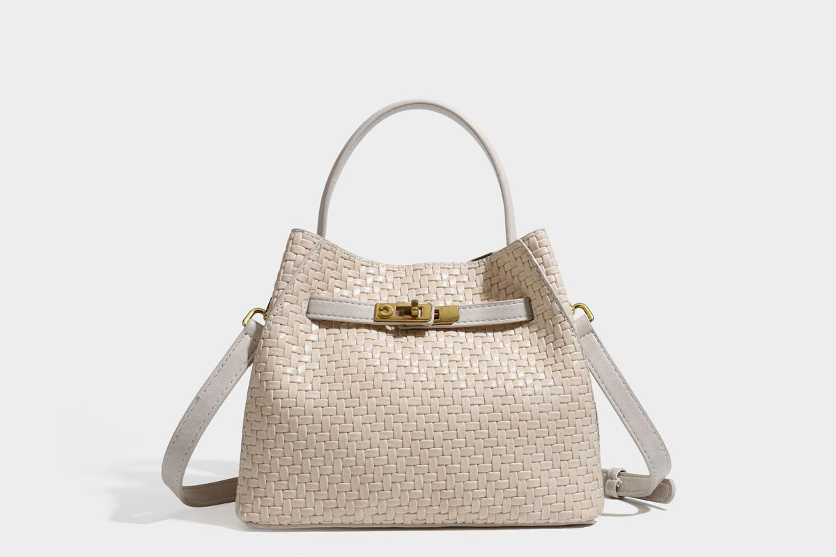 Structured woven leather-look bucket bag with gold-tone turn-lock hardware and detachable shoulder strap, detail view 49