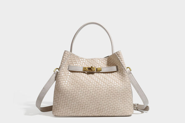 Structured woven leather-look bucket bag with gold-tone turn-lock hardware and detachable shoulder strap, detail view 49