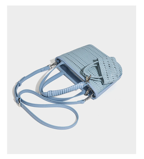 Structured open-weave tote bag with smooth leather-look trim, double top handles, detachable crossbody strap, and mini zip
