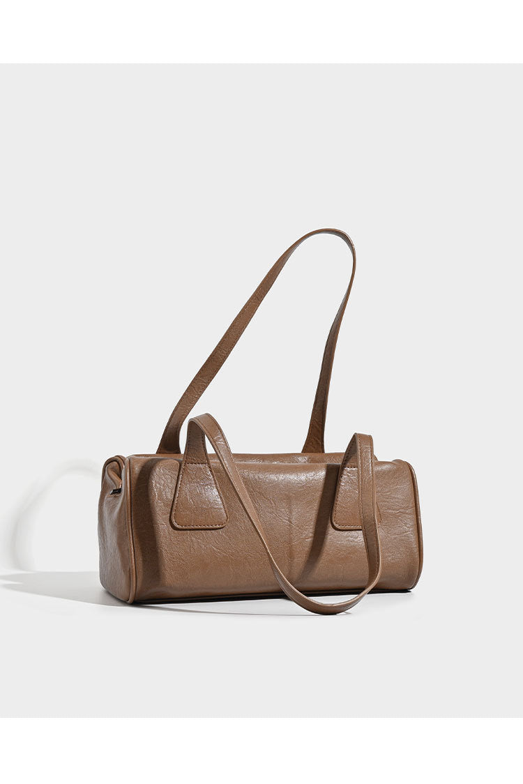 Glossy leather-look barrel shoulder bag with zip closure and top handles, detail view 9