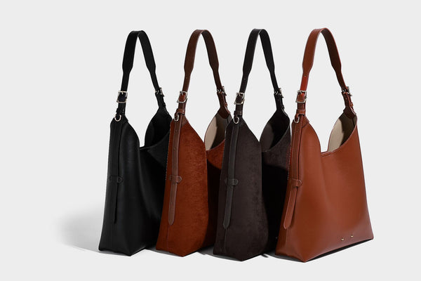 Large open-top hobo shoulder bag in tan leather-look finish with detachable zip pouch and adjustable buckle strap, detail