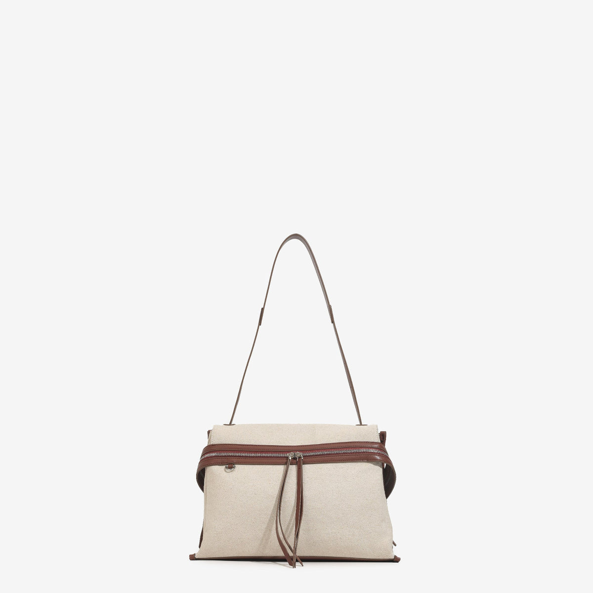 Cream canvas tote bag with brown leather-look trim, dual exterior zip pockets, long shoulder strap, and black flower charm