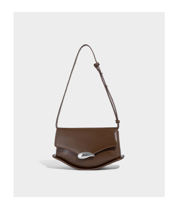 Small structured saddle bag with glossy leather-look finish, angular flap front, silver-tone metal clasp, and slim