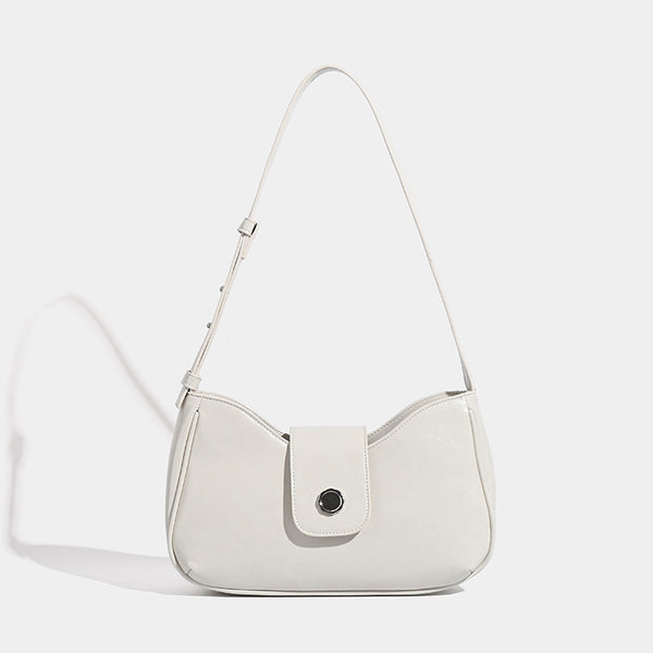 Compact glossy leather-look shoulder bag with round metal snap closure and contrast stitching, detail view 7