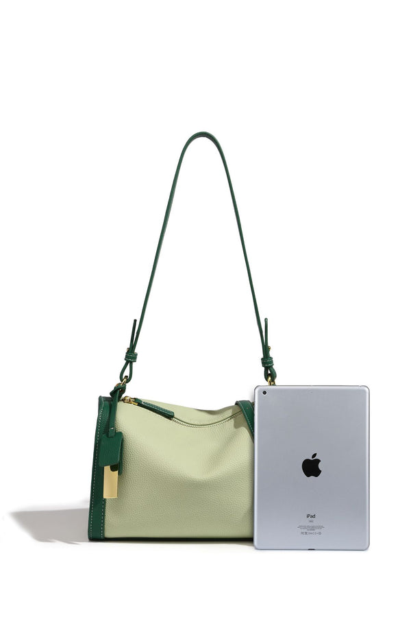 Structured two-tone shoulder bag with pebbled leather-look finish, contrast trim, top zip closure, and gold-tone hardware