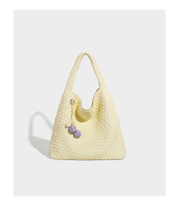 Soft hand-woven slouchy hobo tote bag with knotted tassel charm and single looped shoulder strap, detail view 24
