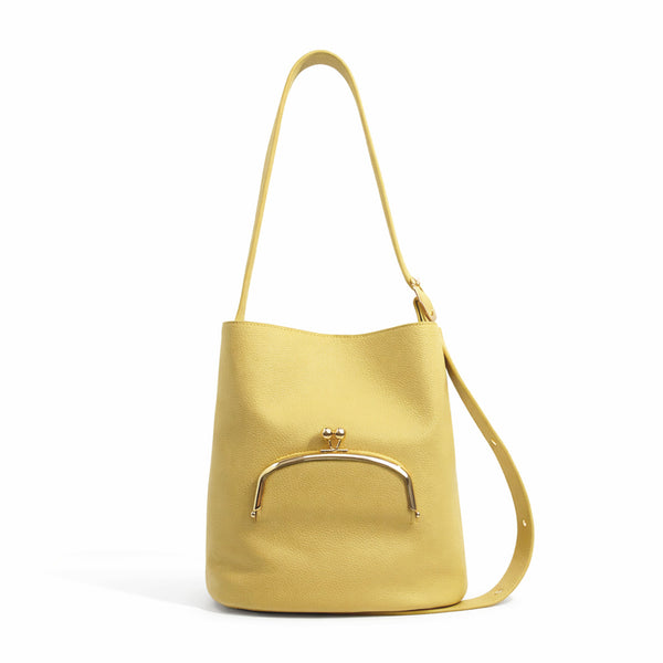 Pebbled textured bucket bag with gold-tone kiss-lock front pocket and adjustable single shoulder strap, detail view 9