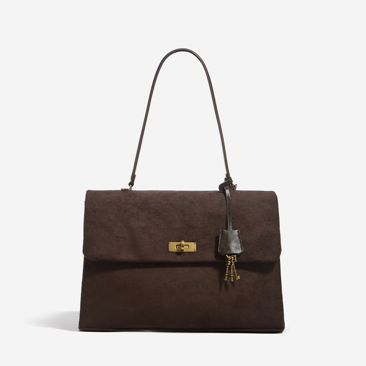 Large structured dark brown suede-finish satchel bag with gold-tone turn-lock closure, key charm accent, and detachable