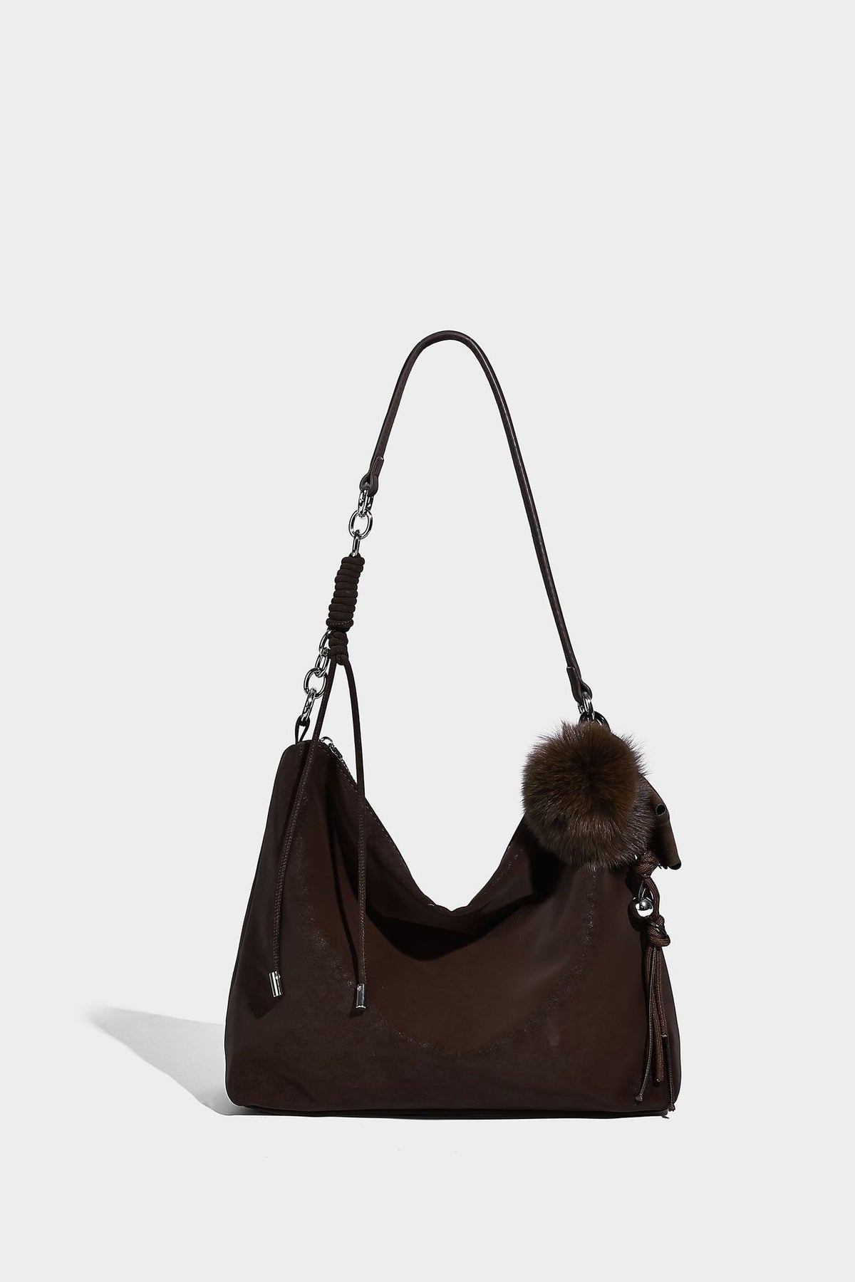 Slouchy matte-finish hobo shoulder bag with tassel cords, silver-tone hardware, and faux-fur pom charm, detail view 28