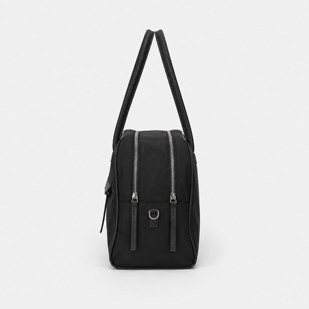 Structured dome top-handle bag in matte nylon with pebbled vegan leather-look trim, zip-top closure, front slip pocket, and