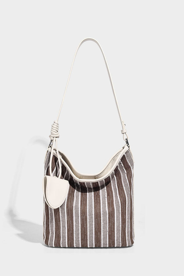 Large striped canvas hobo shoulder bag with cream trim and silver-tone hardware, detail view 11