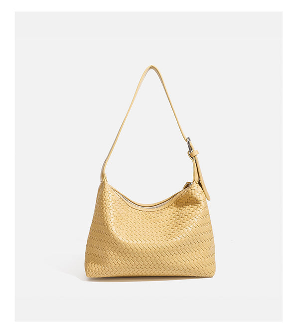 Kompakte gewebte Hobo-Schultertasche mit Reißverschluss oben, silberfarbenem Ringbeschlag und lederähnlicher Außenfläche mit Flechtstruktur, Detail