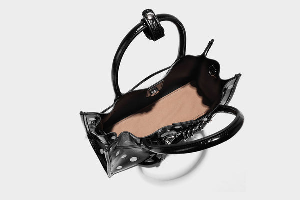 Structured glossy leather-look polka-dot satchel tote with dual top handles and detachable shoulder strap, detail view 25