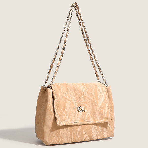 Crinkle-finish leather-look shoulder bag with woven tan-and-metal chain strap and front flap turn-lock closure, detail view 3