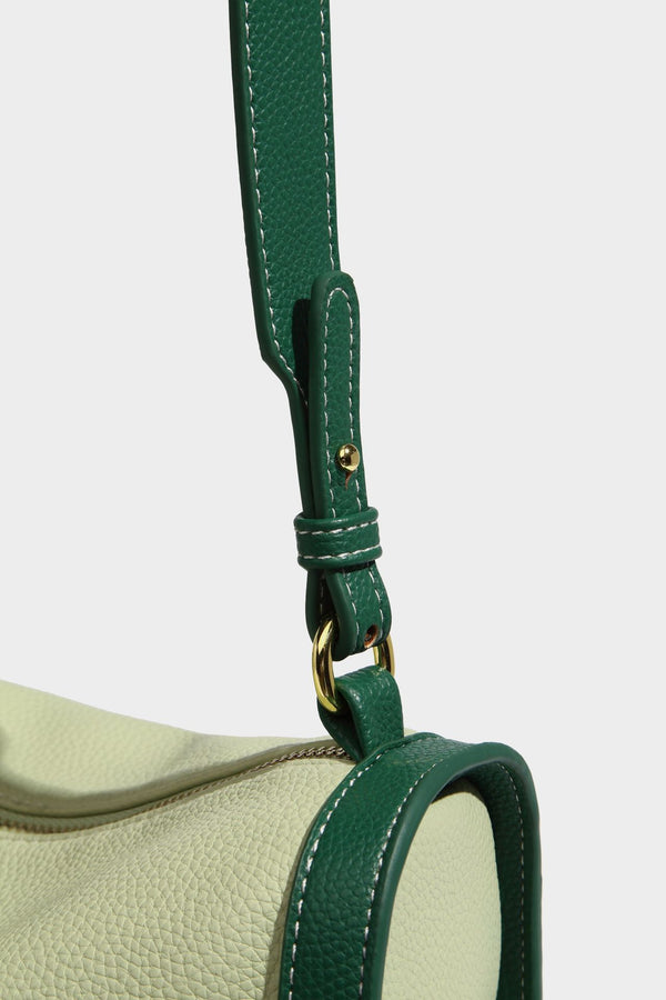 Structured two-tone shoulder bag with pebbled leather-look finish, contrast trim, top zip closure, and gold-tone hardware
