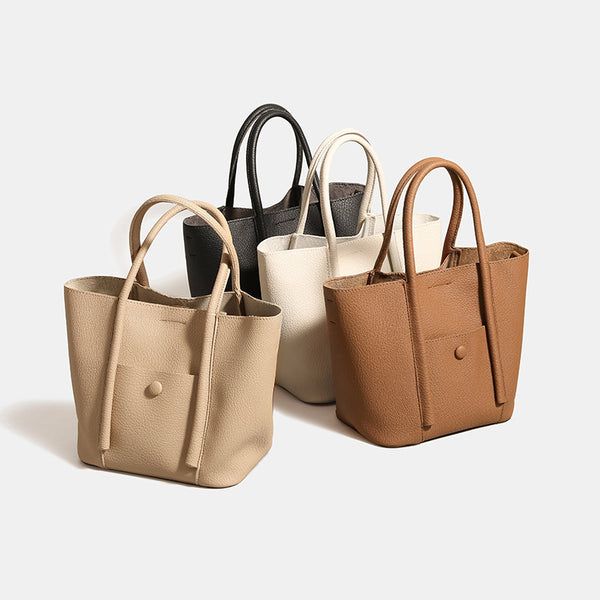 Structured pebbled matte tote bag with front snap pocket, dual top handles, and detachable zip pouch in almond beige, detail
