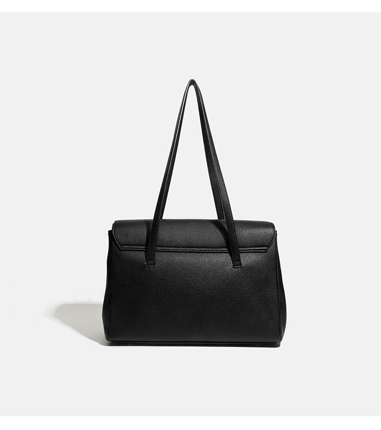 Structured black pebbled-finish flap tote bag with silver turn-lock clasp and long double shoulder straps, detail view 8