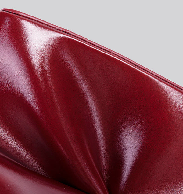 Glossy crescent hobo shoulder bag in deep burgundy with beaded wood tassel charm and gold-tone ring hardware, detail view 15