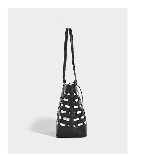 Structured woven lattice cutout tote bag with smooth leather-look trim, dual shoulder straps, and silver-tone hardware