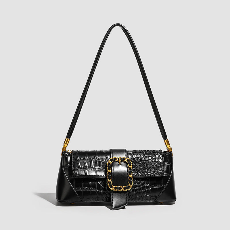 Crocodile-embossed leather-look baguette shoulder bag with gold-tone chain buckle closure and single shoulder strap, detail