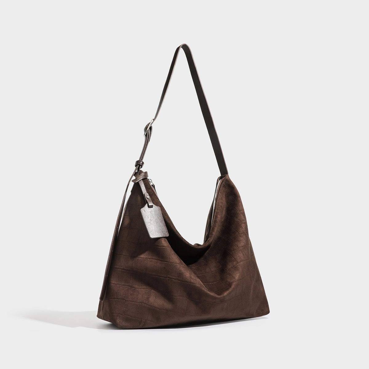 Slouchy hobo shoulder bag in matte croc-embossed leather-look finish with top zip closure and long adjustable strap, detail