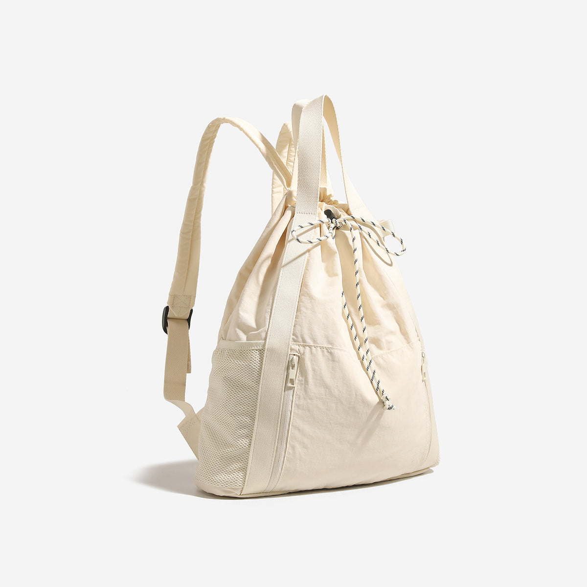 Soft matte drawstring backpack tote with braided cord closure, front zip pocket, and mesh side panels, detail view 3