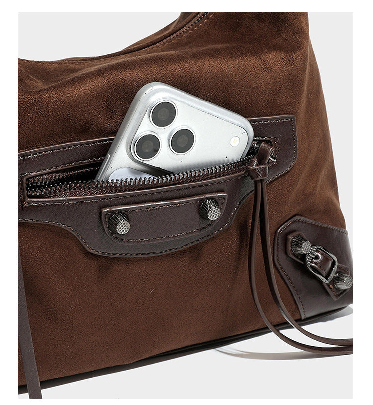 Slouchy suede-finish hobo shoulder bag with dark hardware, exterior zip pocket, tassel ties, and detachable crossbody strap