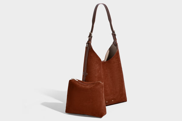 Large open-top hobo shoulder bag in tan leather-look finish with detachable zip pouch and adjustable buckle strap, detail
