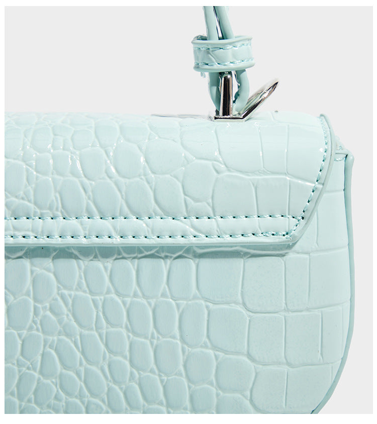 Glossy croc-embossed mini saddle bag with silver-tone turn-lock clasp and short top handle, detail view 13