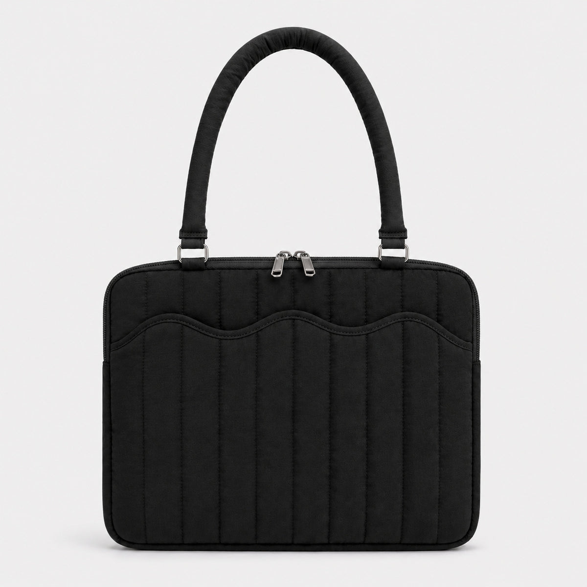 Quilted colorblock handbag with wavy scalloped front panel, padded arched top handles, and dual zip closure, detail view 9