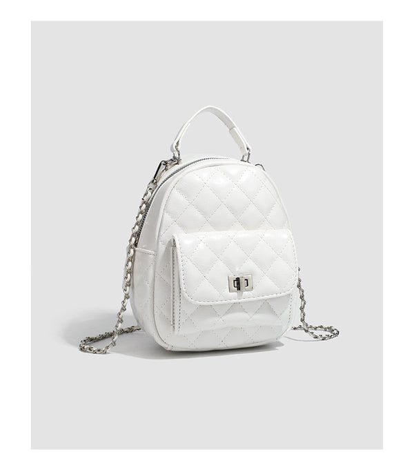 Quilted leather-look backpack purse with chain strap and turn-lock front pocket, detail view 18
