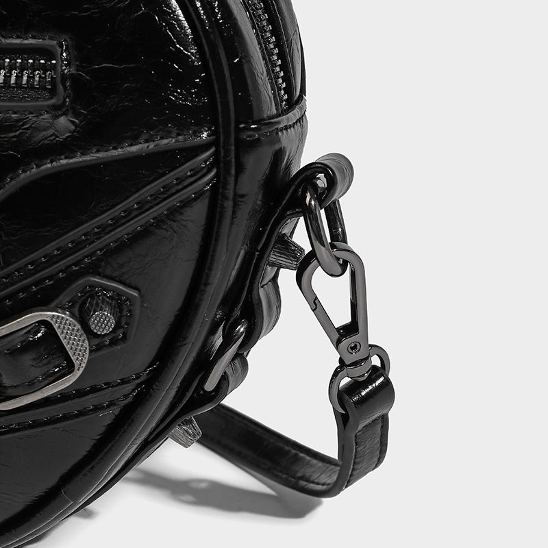 Mini heart-shaped crossbody bag with glossy crinkled finish and moto buckle hardware, detail view 23
