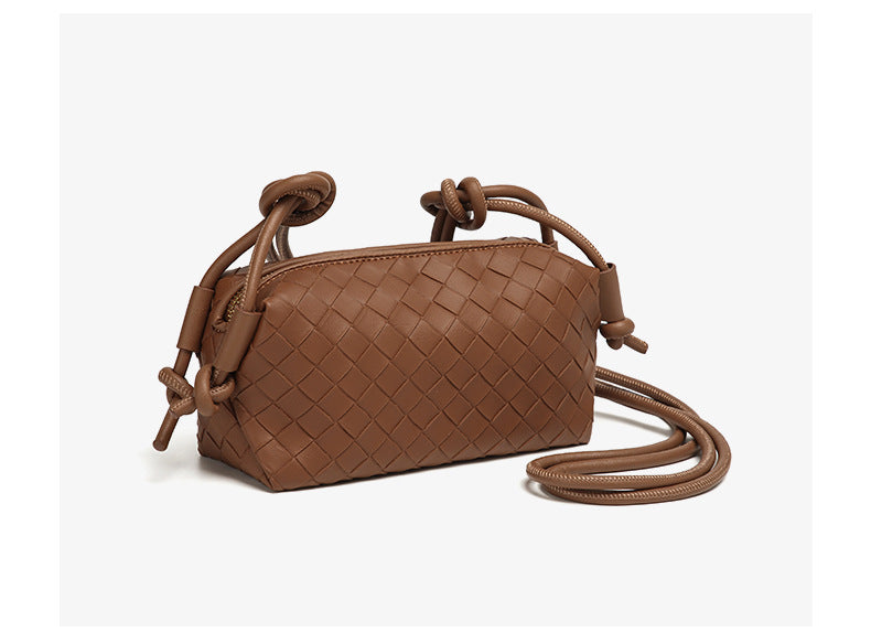 Small rectangular woven-texture mini crossbody bag with knotted rope strap and gold-tone zip closure, detail view 19