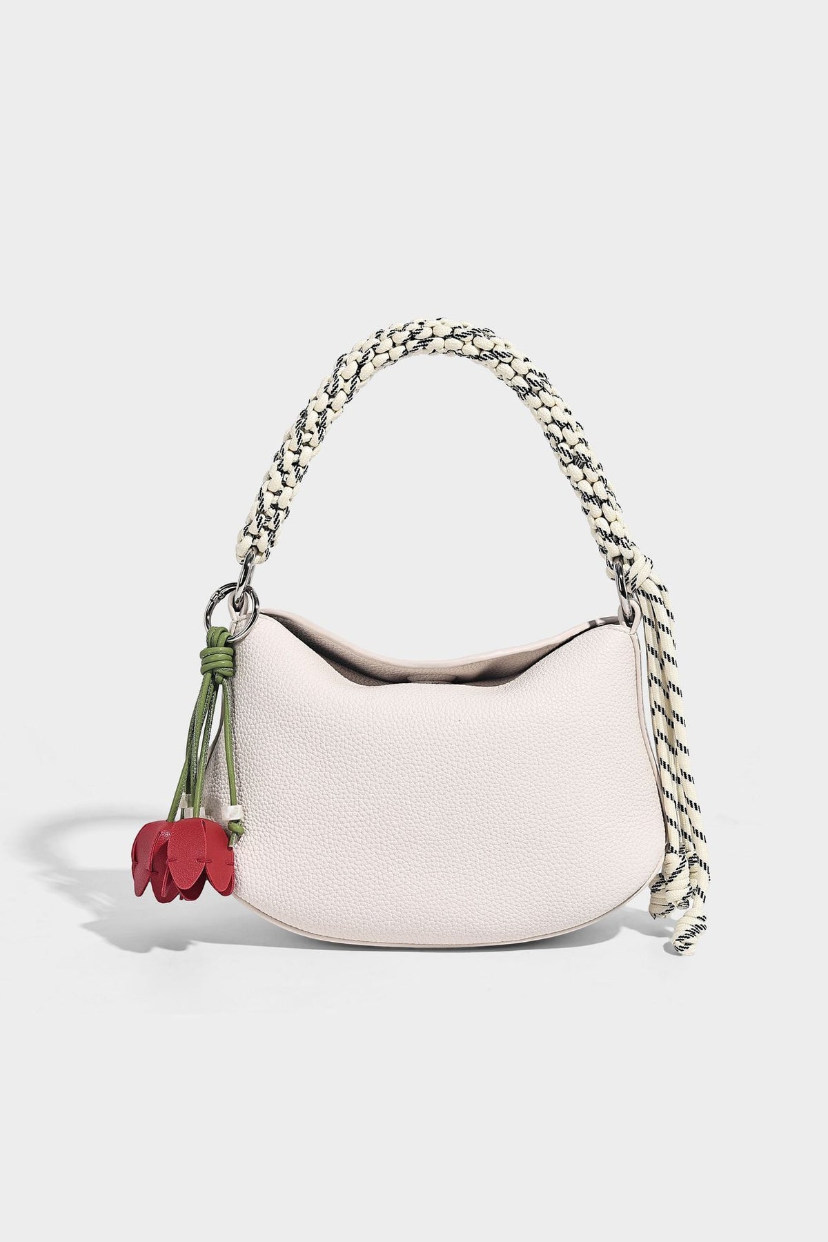 Small crescent half-moon bag in pebbled leather-look finish with braided top handle, silver-tone ring hardware, and, detail