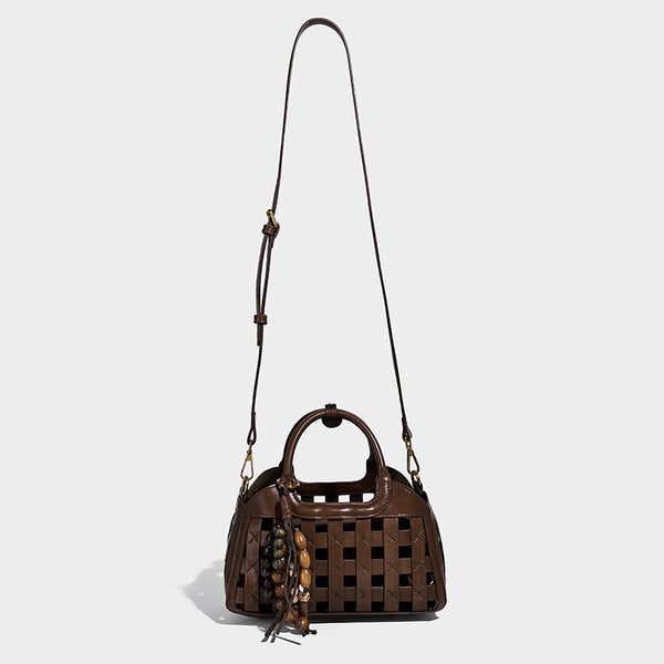 Small structured woven lattice top-handle satchel bag with bead-and-tassel charm and gold-tone hardware, detail view 3