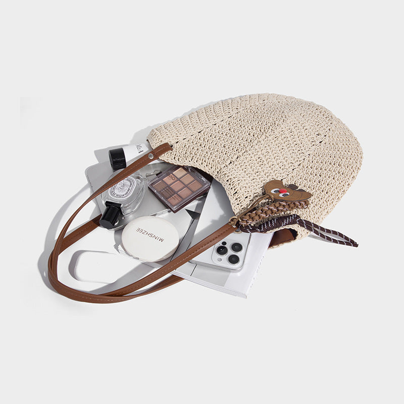 Woven crochet open-top shoulder tote bag with slim brown leather-look straps and braided charm accent, detail view 4