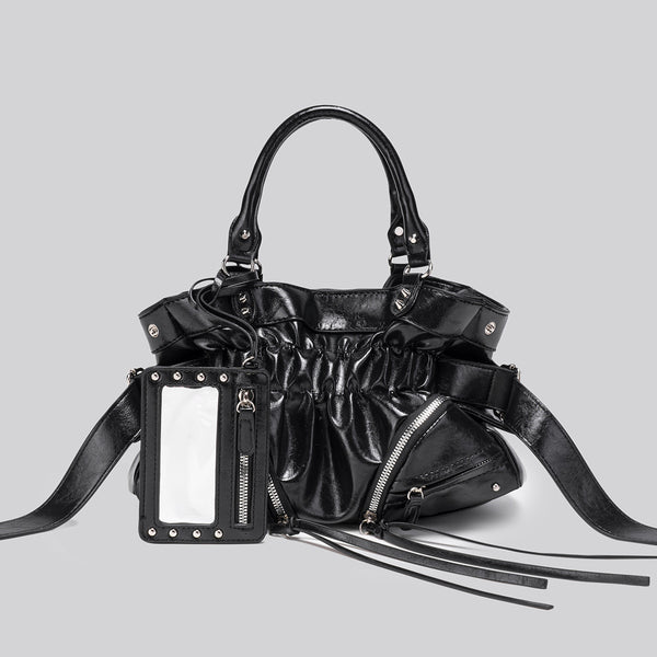 Black glossy ruched convertible tote bag with silver-tone rivets, detachable wide shoulder strap, external zip pouch, and