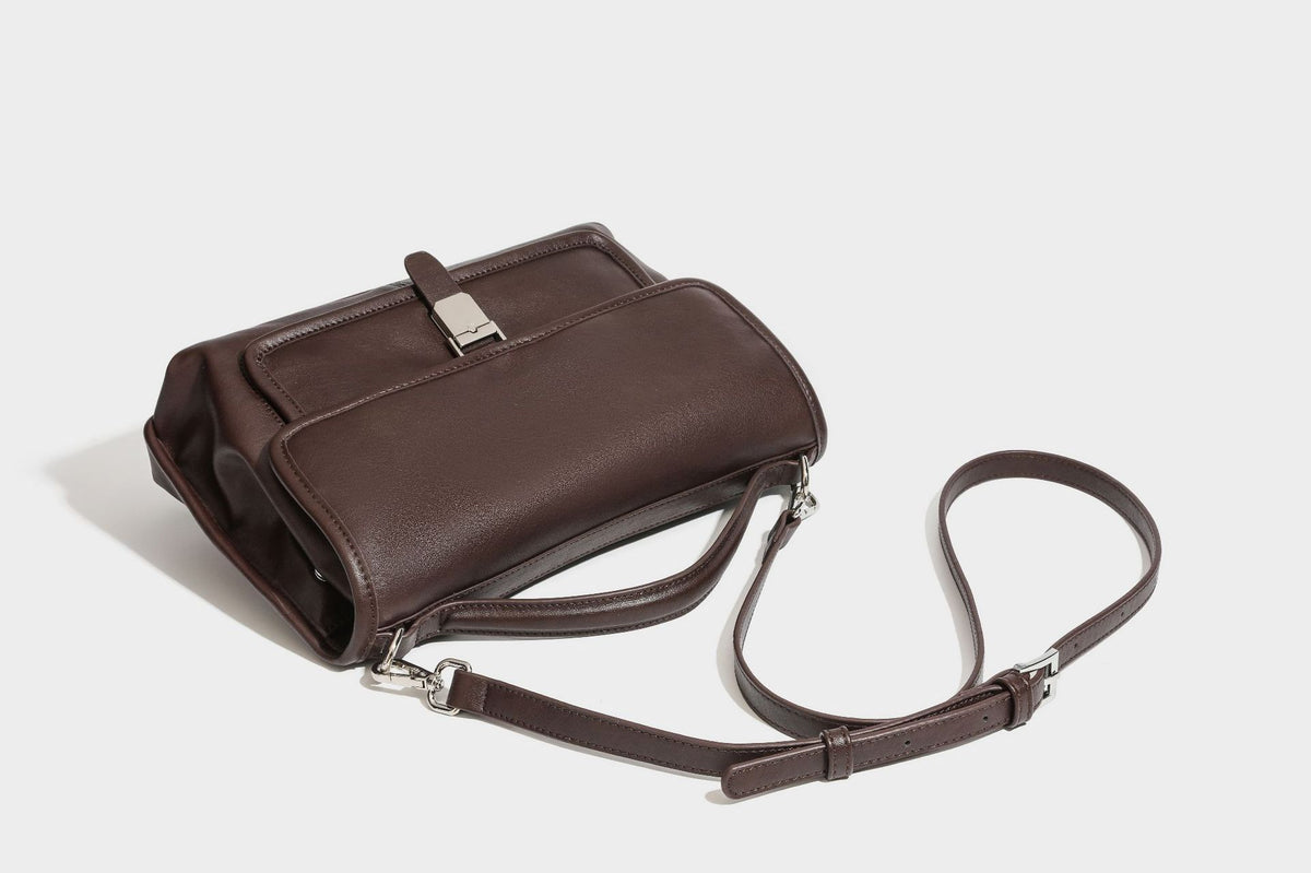 Structured rectangular satchel bag in dark espresso brown with smooth leather-look finish, flap front with silver turn-lock