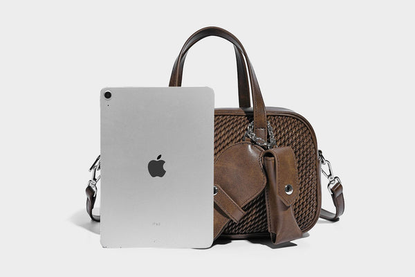 Structured woven-texture front top-handle handbag with zip closure, dual handles, detachable shoulder strap, and matching