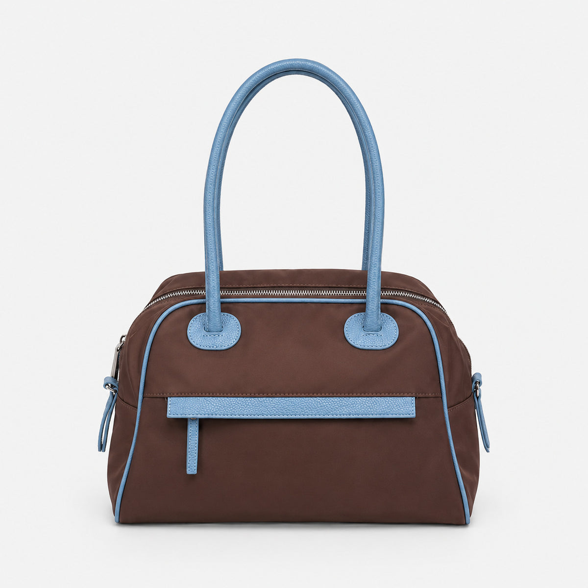 Structured dome top-handle bag in matte nylon with pebbled vegan leather-look trim, zip-top closure, front slip pocket, and