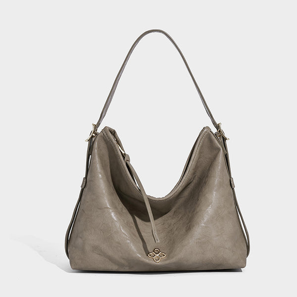 Slouchy leather-look hobo shoulder bag with gold-tone hardware and adjustable strap in brown, detail view 14