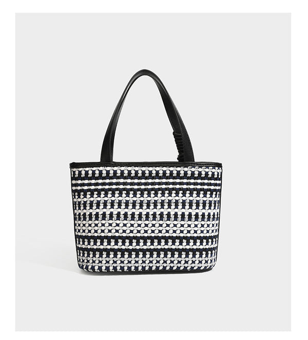 Kleine, strukturierte Tote-Bag aus gewebtem Karomuster mit glattem Besatz in Lederoptik, zwei Tragegriffen, abnehmbarem Schulterriemen und