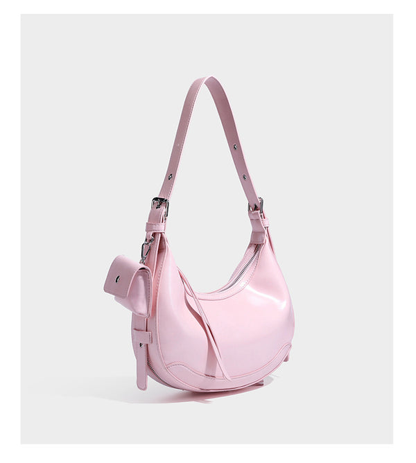 Glossy leather-look crescent hobo shoulder bag with dark contrast trim, silver-tone hardware, and attached mini flap pouch