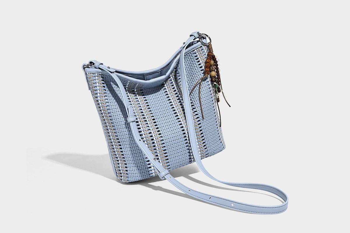 Woven bucket shoulder bag with leather-look trim, silver-tone hardware, and beaded tassel charm, detail view 40