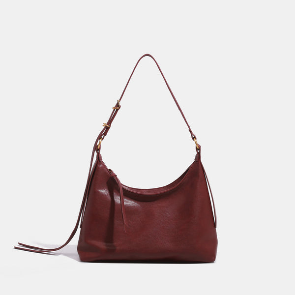 Slouchy hobo shoulder bag in smooth leather-look finish with gold-tone hardware and adjustable strap, detail view 8
